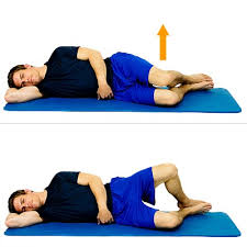 Person lying on their side performing a clamshell exercise to activate the hip abductors